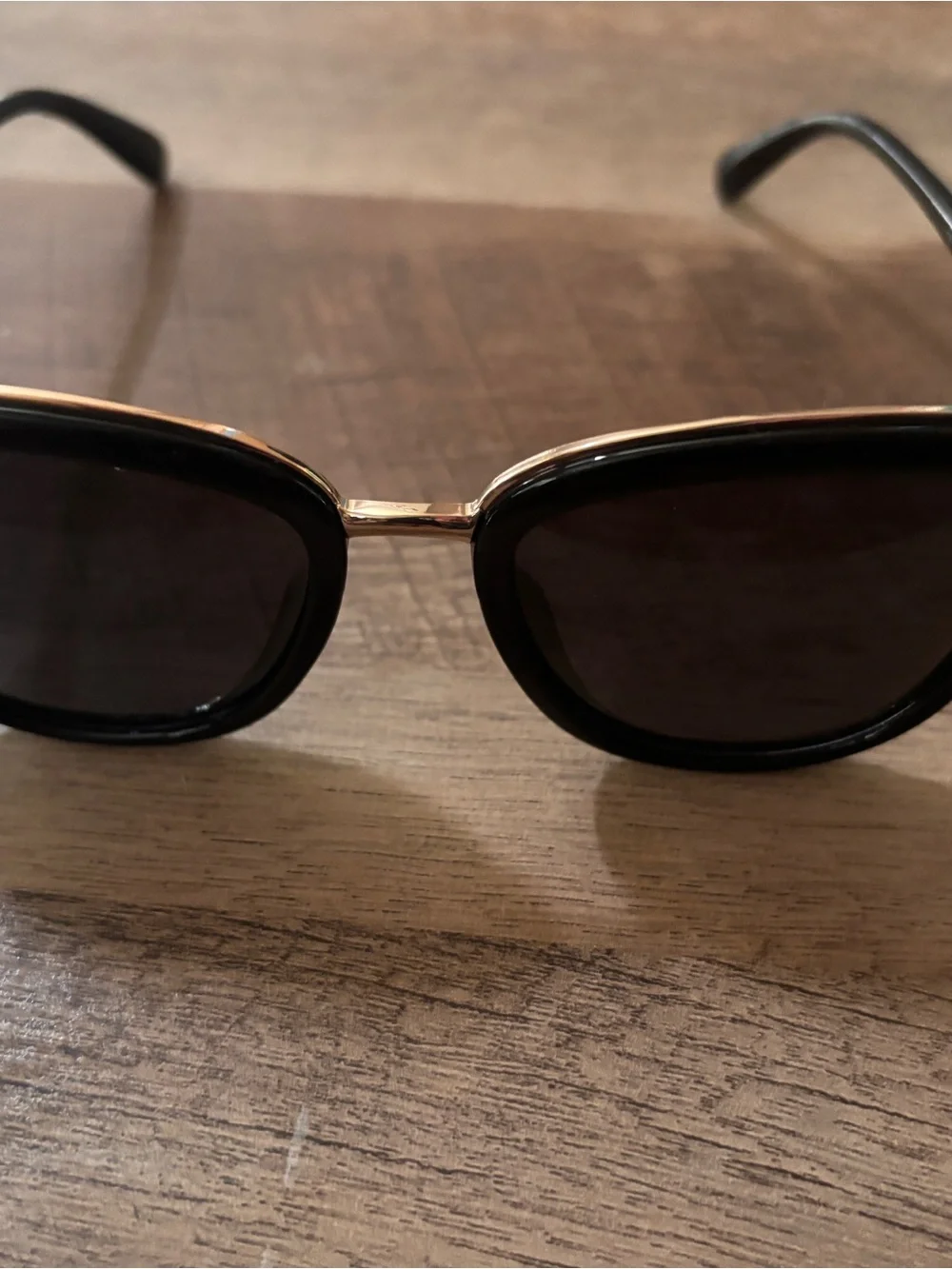 Black Oval Sunglasses with Gold Bridge